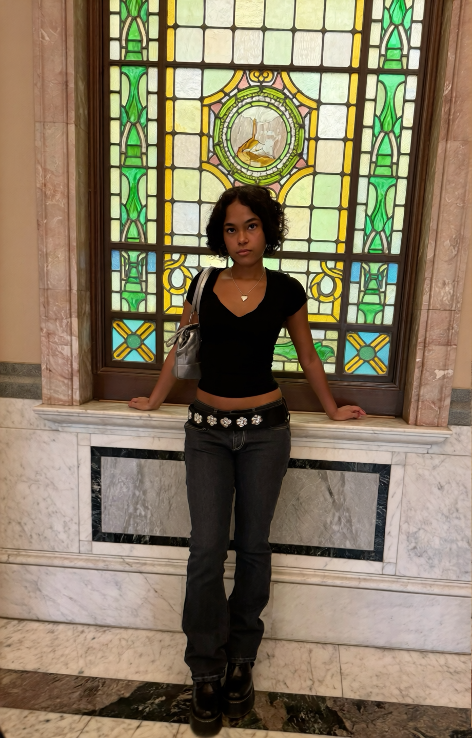 AI portrait of a woman in dark clothing standing before tall stained glass windows